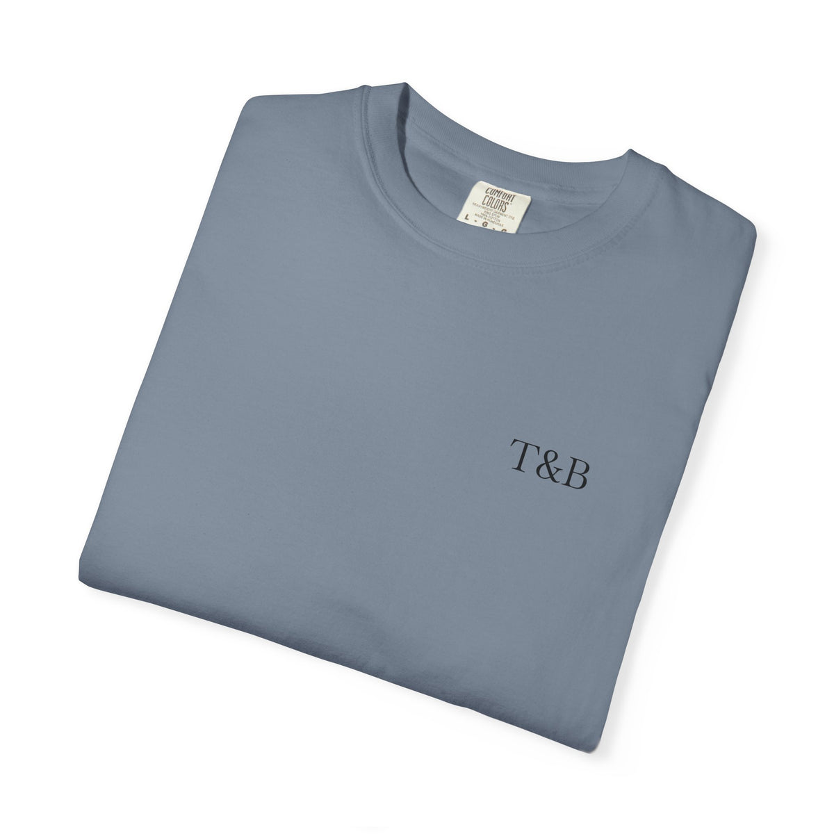 Folded gray t-shirt with a small flag design and text on a white background