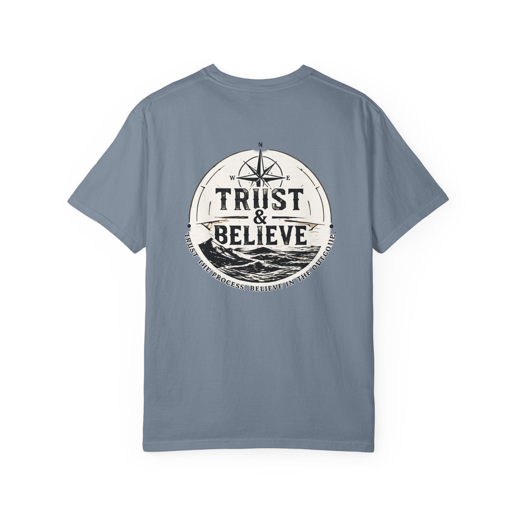 Blue t-shirt with 'Trust & Believe' graphic on a white background