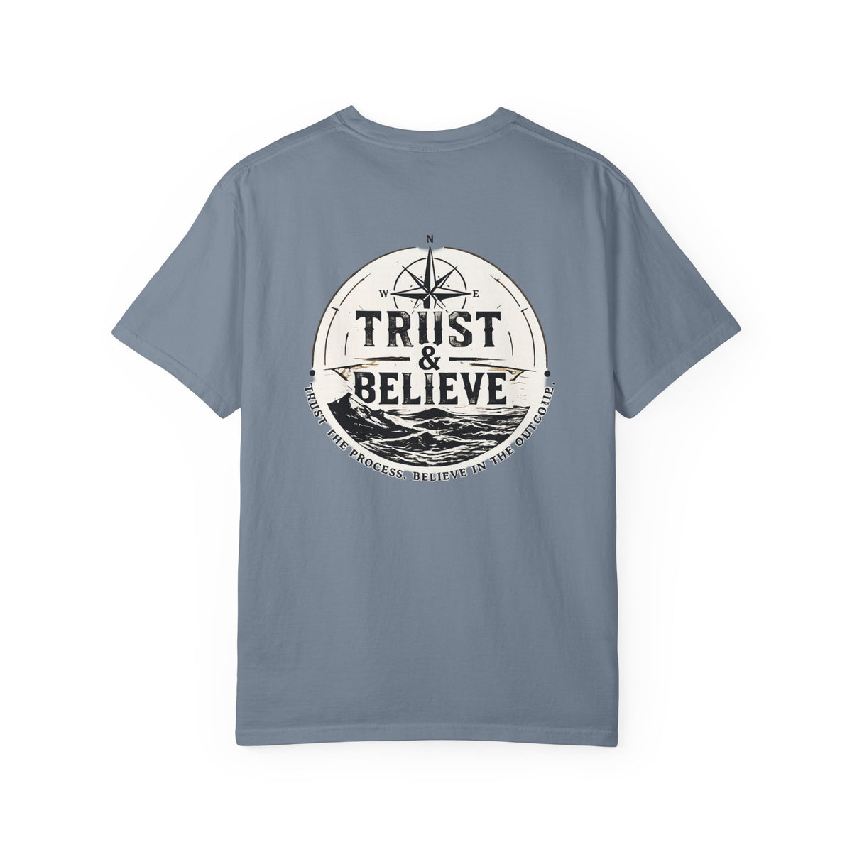 Blue t-shirt with 'Trust & Believe' graphic on a white background